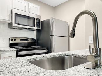 Stainless steel sink with faucet